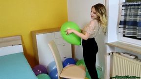 sitpopping twelve U14 balloons