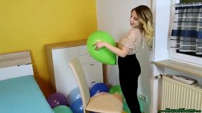 sitpopping twelve U14 balloons