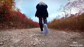 Follow my footsteps along the path in the evening lonely forest
