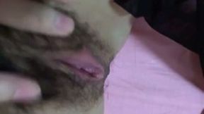Korean girl was fingering her quite hairy pussy in a tender slow way