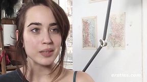 Brunette beauty plays with her shaved pussy in solo on camera