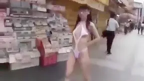 Seductive Japanese Beauty Struts Semi-Naked Through Tokyo Streets