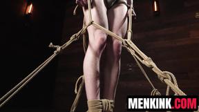 Jesse Stone is bound in rope unable to resist Tony Genius tormenting