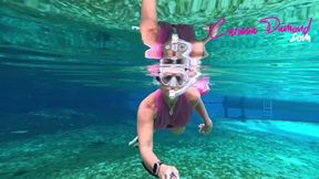Carissa in the pink suit snorkeling in the springs and topless