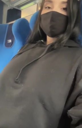 Woman in mask on bus