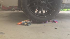 Chrissy running toys over with her big truck