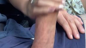 Asian babe jacks off big white cock while driving