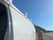 Checking why back van door rattling.  Side of the road.  Naked.