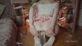 A beautiful girl stretches her ass with a huge toy