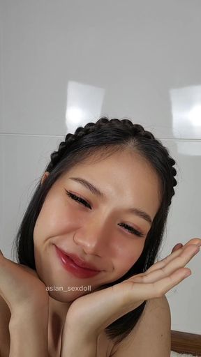 Smiling Asian woman in studio