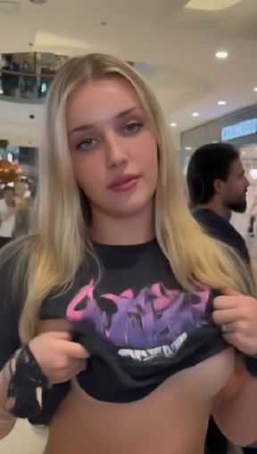 goth, titty drop, a young, blonde Caucasian woman, video created by AI