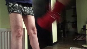 Red boots ball kicking