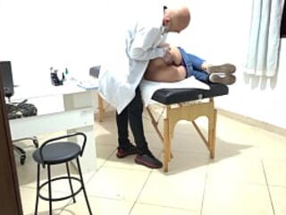 Proctologist performs anal exam on constipated patient.