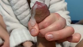 His girlfriend lubricates his boyfriend&#039;s cock well and she gives him a great handjob to make his cum explode