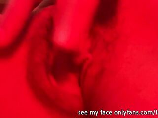 Excited gal masturbates her pussy in the club with red led lights