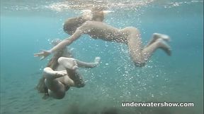 Julia and Masha are swimming nude in the sea