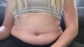 Watch my belly grow while I engorge myself with a massive burger, fries, and onion rings! I squish and squeeze and jiggle my belly between every bite.