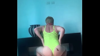 Sissy faggot Lupa dances and shows her ass with sexy tattoo. It is in a bright attire and a collar