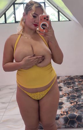 Curvy blonde in yellow bikini