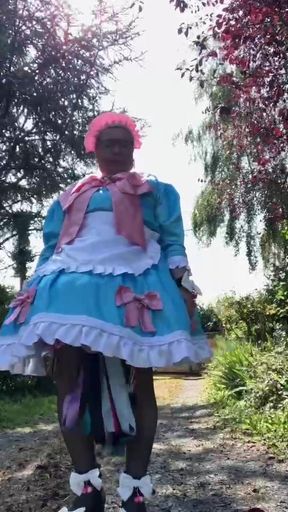 In a blue maid outfit with pink bows for a day