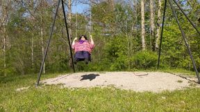 Molly swinging in the park in her beautiful sexy outfit