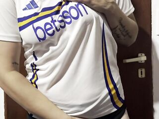 Getting warmed up in advance of the football match... female fan undressing...