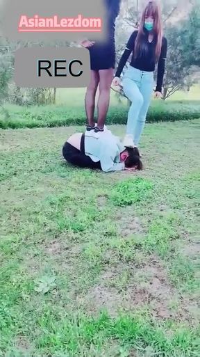 Outdoor humiliation as two mistresses dominate