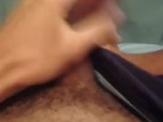 Masturbating