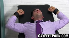 Businessman tickled without any mercy