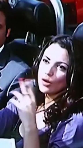 Woman in car with cigarette