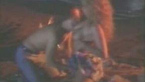 Outrageously hot and busty blonde babe on the beach at night