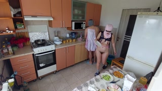 Amateur couple having fun in the kitchen.