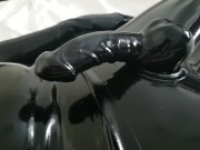 Close-up latex cock and mask