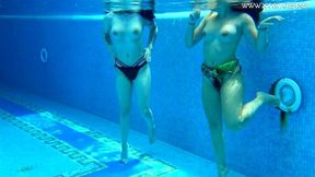 Sexy babes with big tits swim underwater in the pool