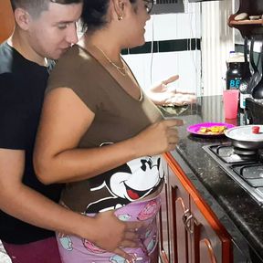 My stepmother gives me a rich blowjob in the kitchen.