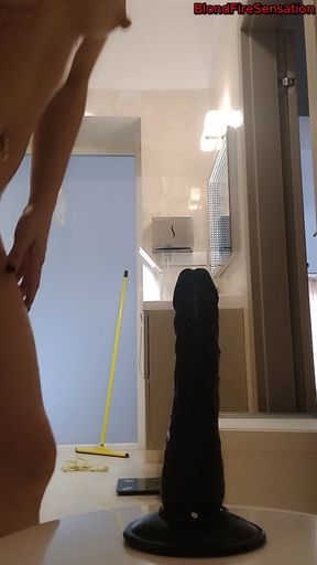 Riding a black dildo