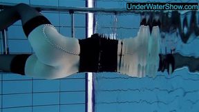 Hot blondie in stockings swims