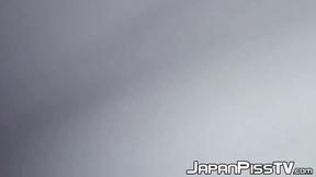 ”Delectable Japanese babe is peeing outside during day time”