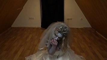 Blonde babe is sucking a big, fake dick while dressed up in a Halloween zombi- bride costume