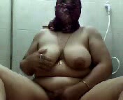 Arab BBW lady covers her face and gets naked on webcam