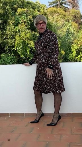 On my terrace in a dress and heel.