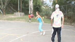Paris Milan plays basketball outdoors