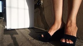 Models her pronounced arches in blue high heels (7)