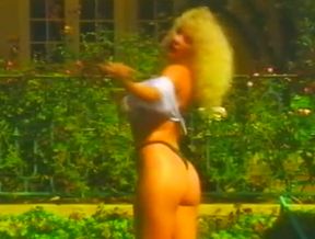 Busty and hot blondie with juicy butt strips on cam by the pool