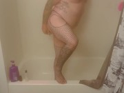 Caged fag bou plays with toys in the shower