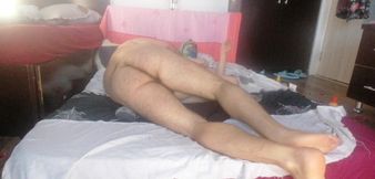 Sensual massage of a hot couple with oil on the body. Foreplay in the bedroom with an amateur couple.