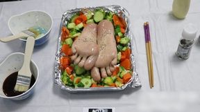 The Asian girl is bound under the table, her bare feet tied to the tabletop. We're going to lick these bare feet; let's start by sprinkling some seasonings and side dishes.