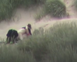 I caught a horny couple making love in the sandy dunes