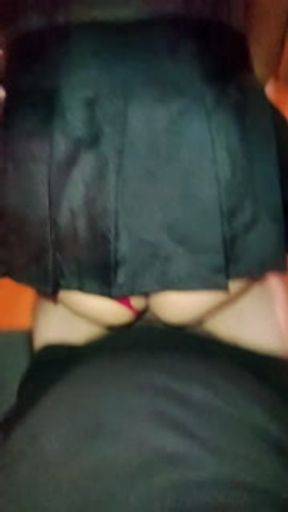 I find her in the living room with her miniskirt and the pregnant woman