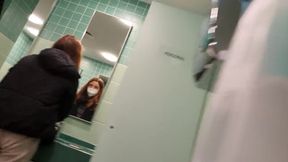 In the public toilet at a motorway service station